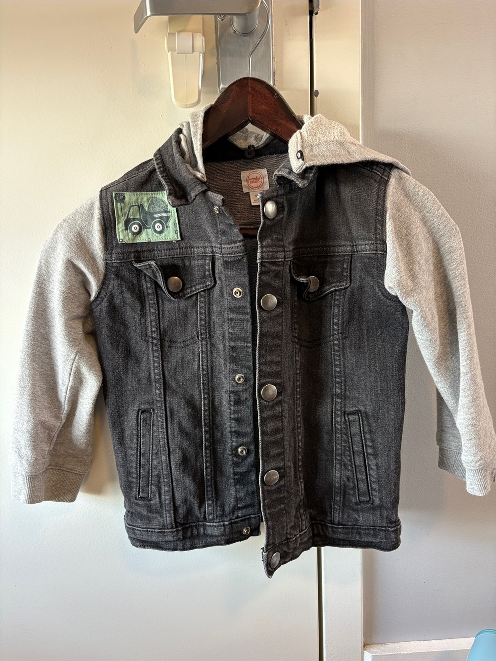 wonder nation Black Denim Jacket with Gray Hoodie Sleeves and Green Patch